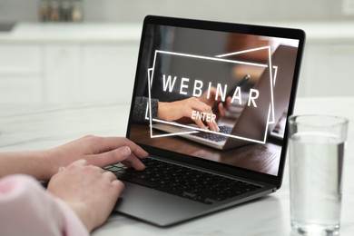 Image of Webinar. Woman using laptop at table, closeup