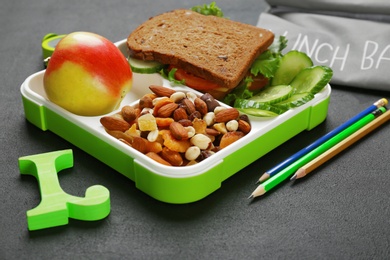 Photo of Lunch box with appetizing food on table