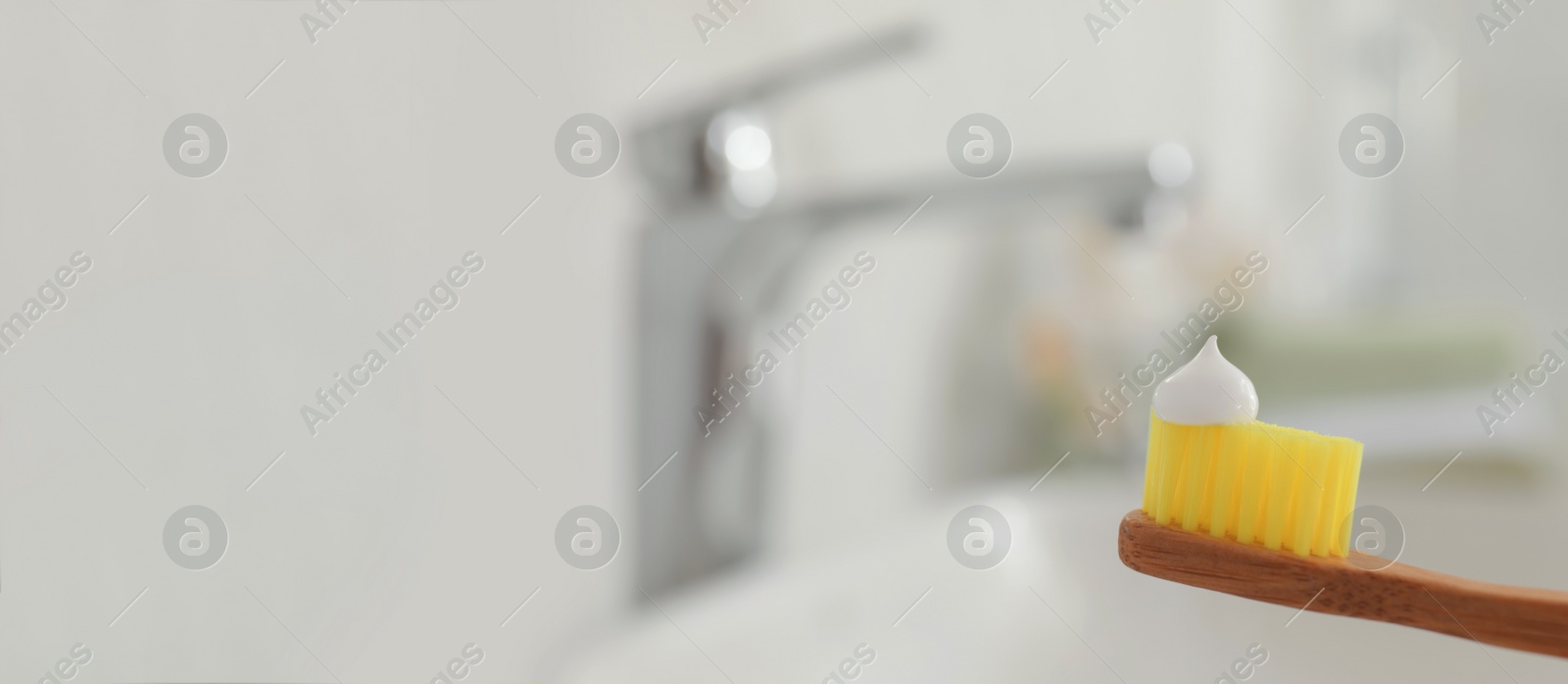 Image of Brush with toothpaste in bathroom, space for text. Banner design