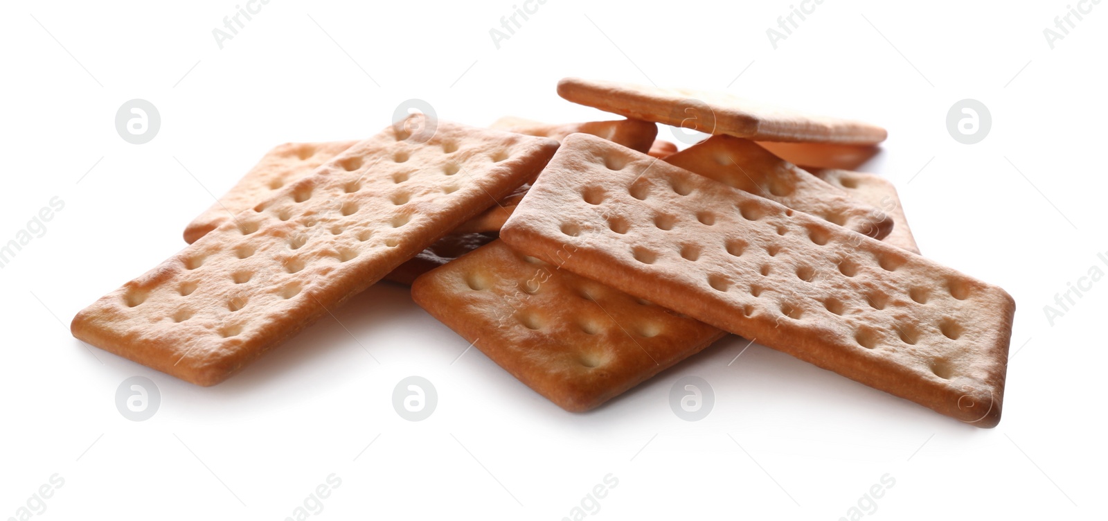 Photo of Crispy crackers isolated on white. Delicious snack