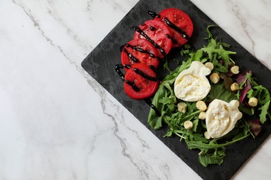 Photo of Delicious burrata cheese, tomatoes and arugula on white marble table, top view. Space for text