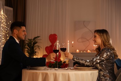 Lovely couple having romantic dinner on Valentine's day in restaurant