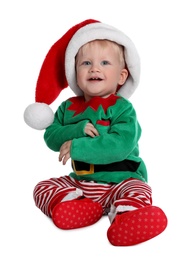 Cute baby in Santa's elf clothes sitting on white background. Christmas suit