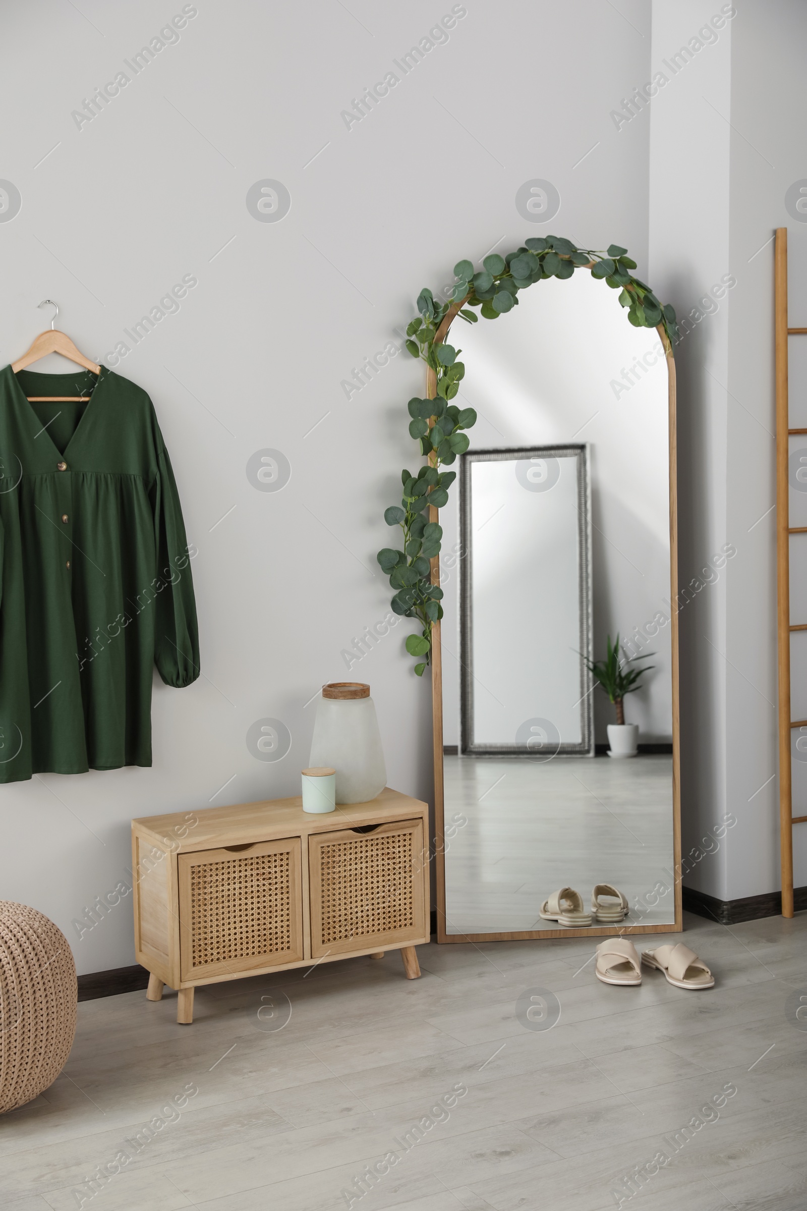 Photo of Stylish room interior with leaning floor mirror