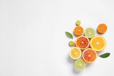 Photo of Composition with different citrus fruits on white background, top view