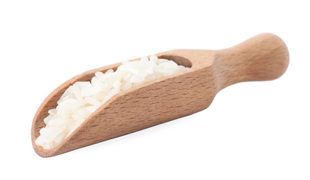 Photo of Uncooked rice in wooden scoop isolated on white