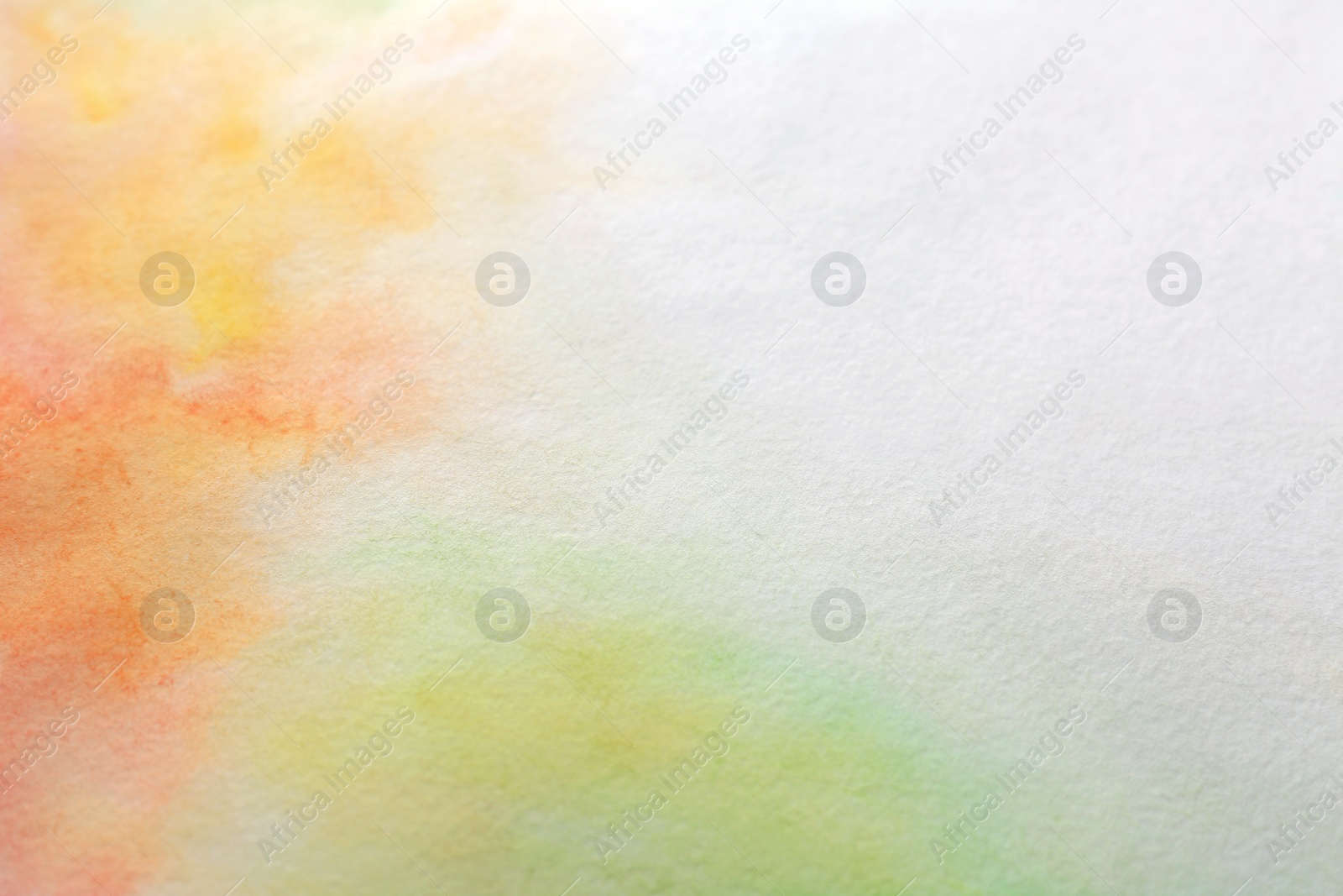 Photo of Colorful paints on white paper. Abstract background