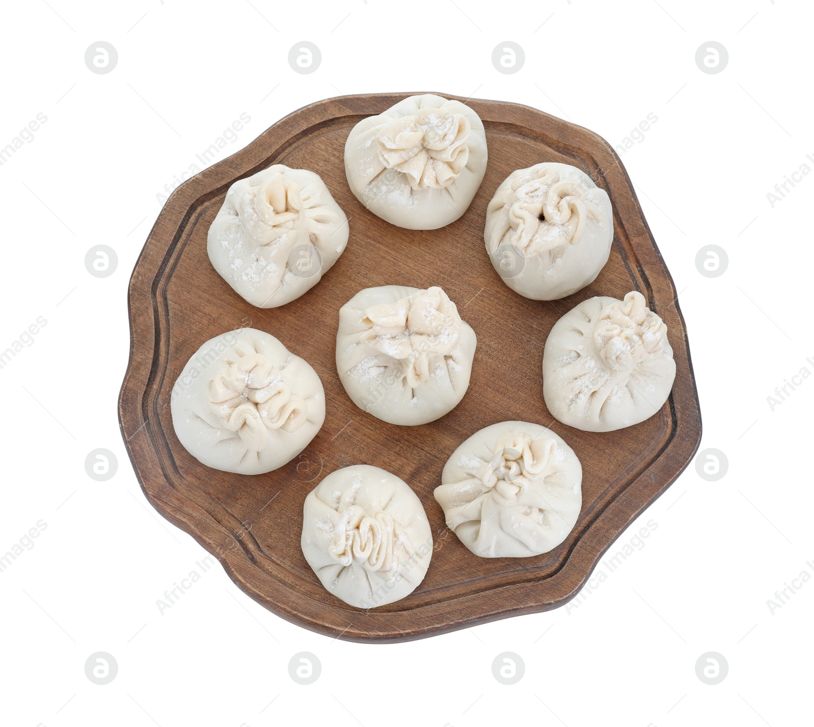 Photo of Board with uncooked khinkali (dumplings) isolated on white, top view. Georgian cuisine