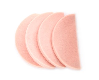 Slices of tasty boiled sausage on white background, top view