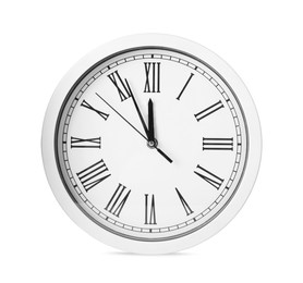 Photo of Clock showing five minutes until midnight isolated on white. New Year countdown