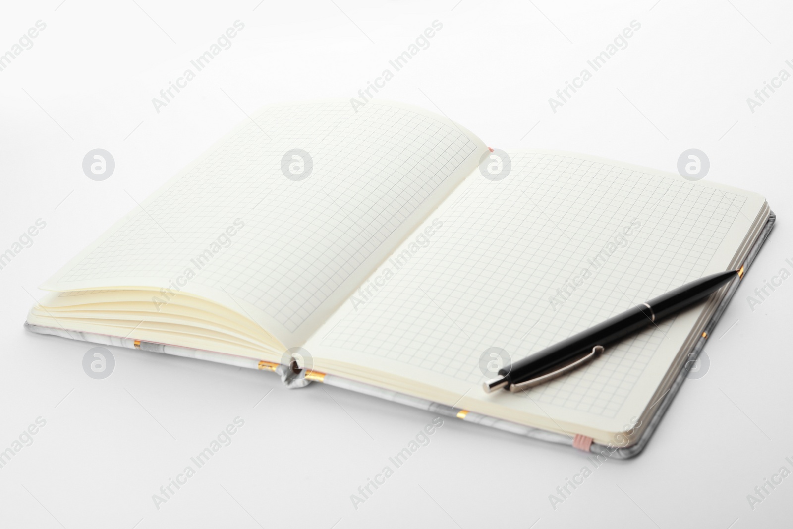 Photo of Stylish open notebook and pen isolated on white