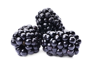 Photo of Tasty ripe juicy blackberries on white background