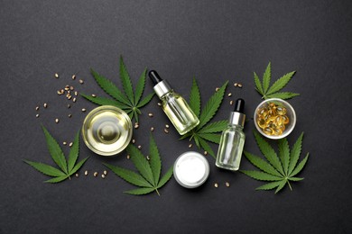 Photo of Flat lay composition with hemp leaves, CBD oil and THC tincture on black background