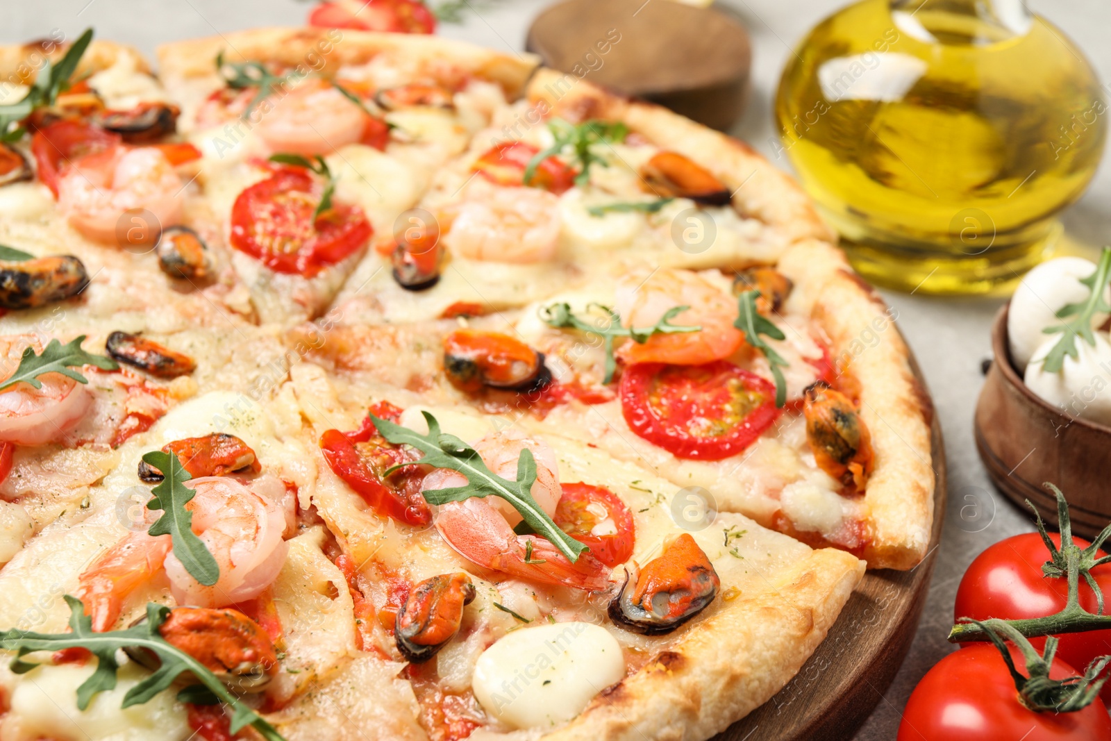 Photo of Delicious seafood pizza on table, closeup view