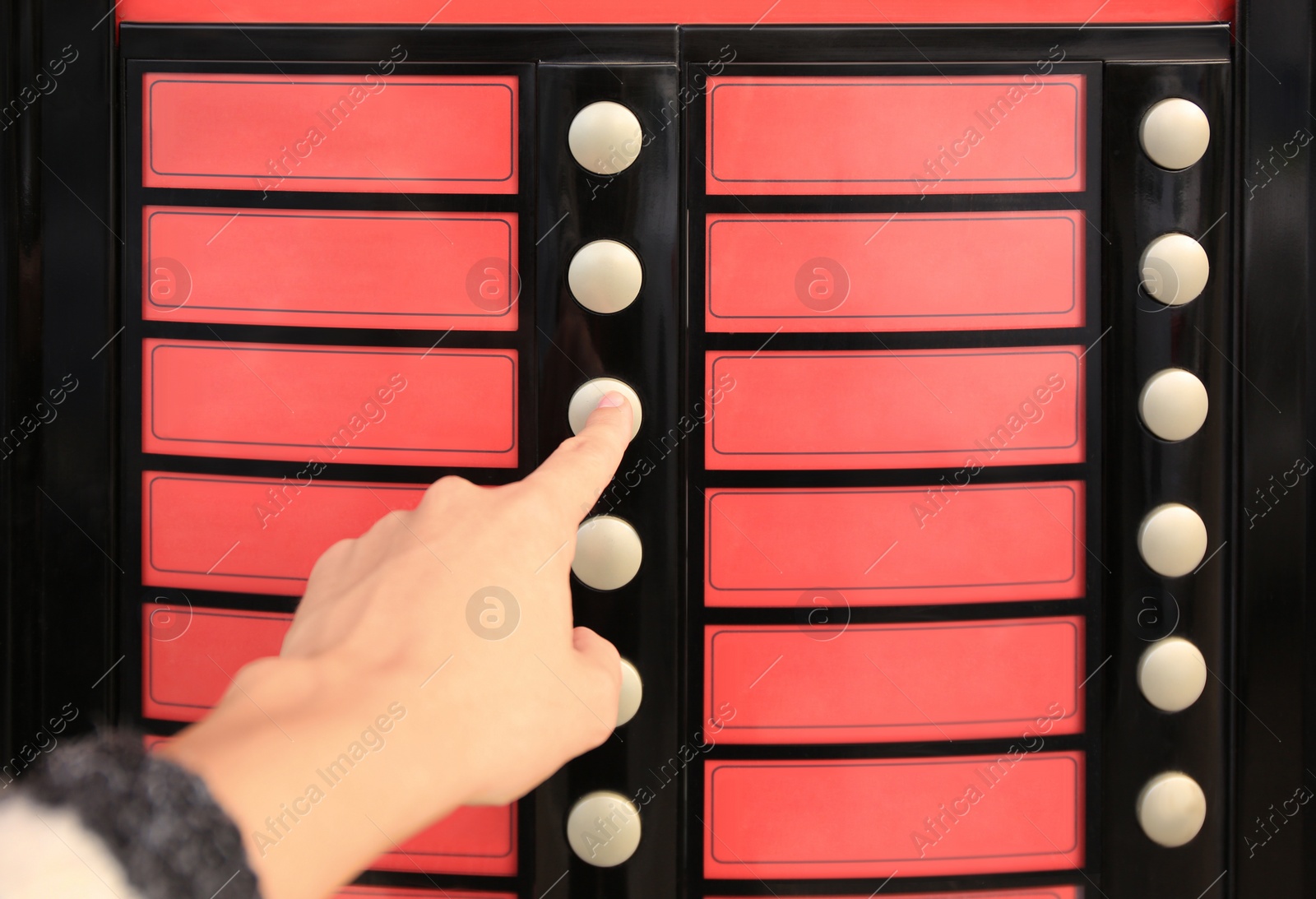 Image of Using coffee vending machine. Woman pressing button to choose drink, closeup