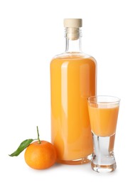 Photo of Tasty tangerine liqueur and fresh fruit isolated on white