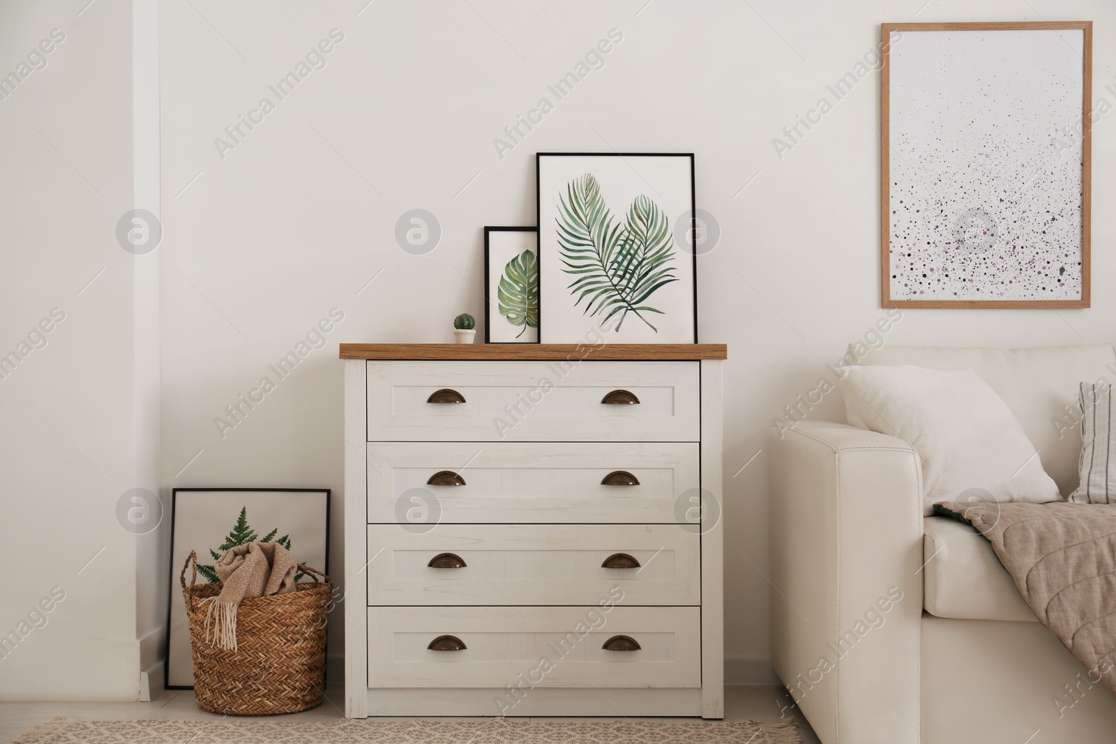 Photo of Modern chest of drawers in living room. Interior design