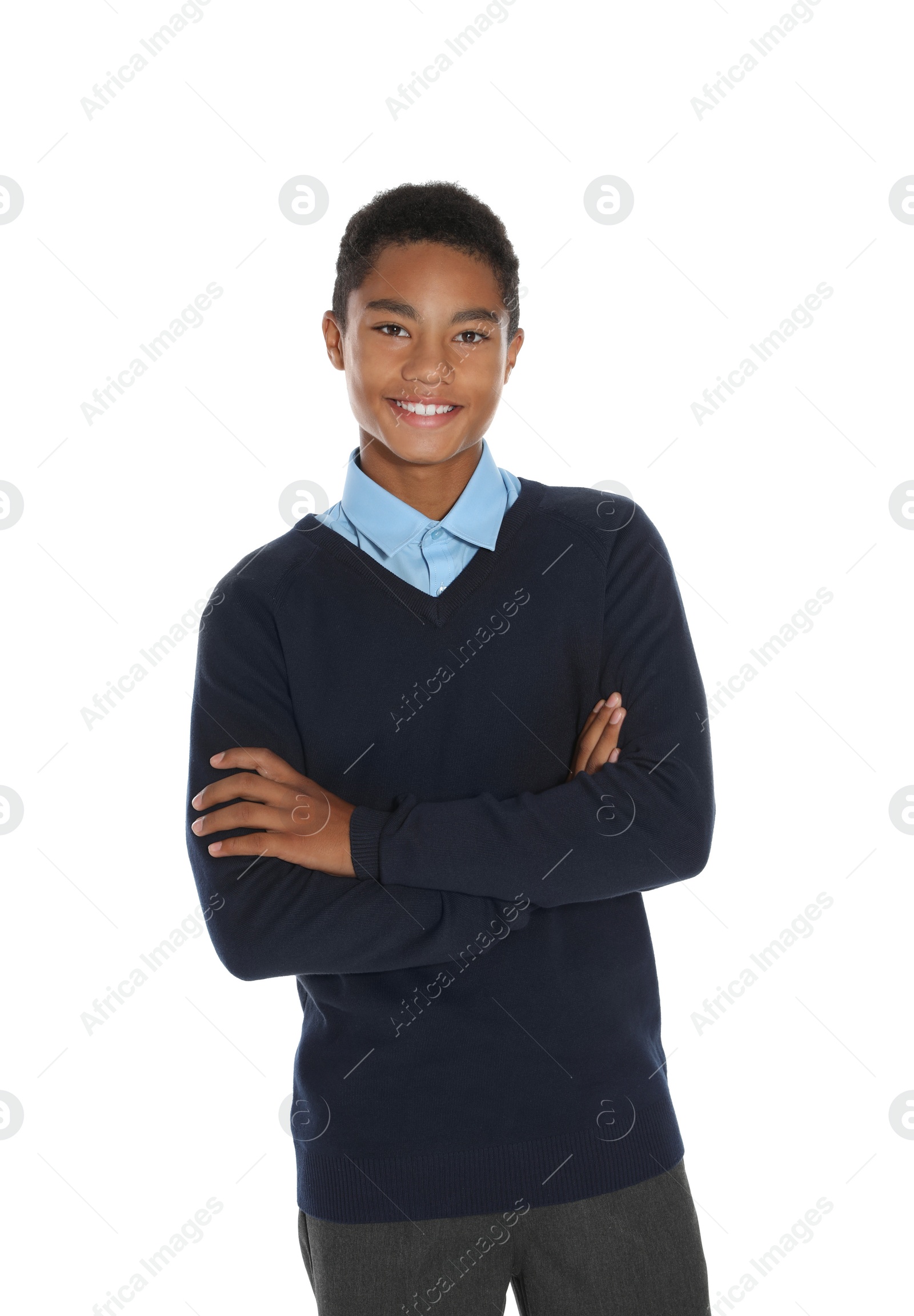 Photo of African American teenage boy in stylish school uniform on white background