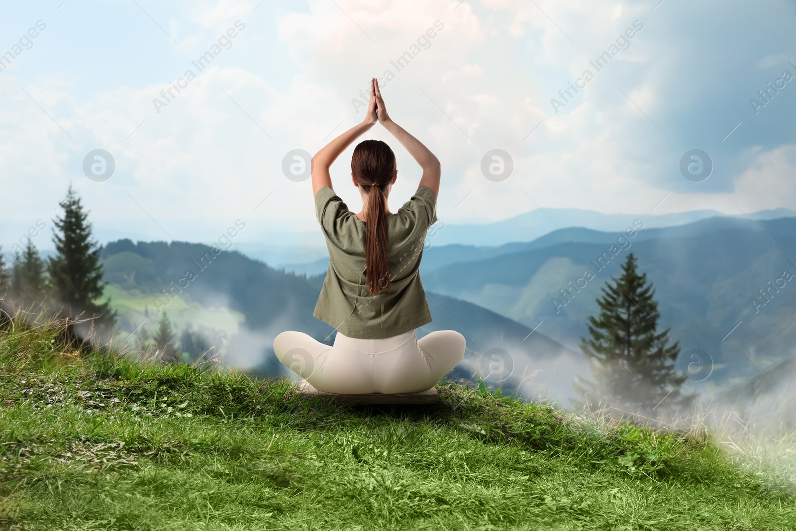 Image of Woman meditating in beautiful mountains, back view