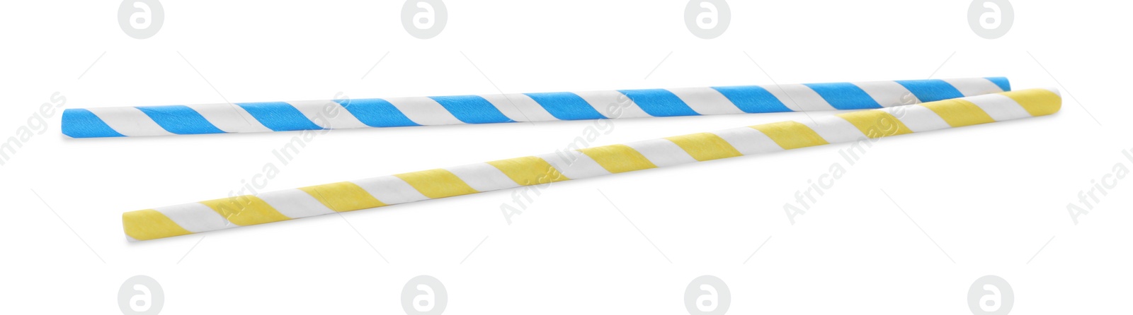 Photo of Different paper cocktail straws on white background