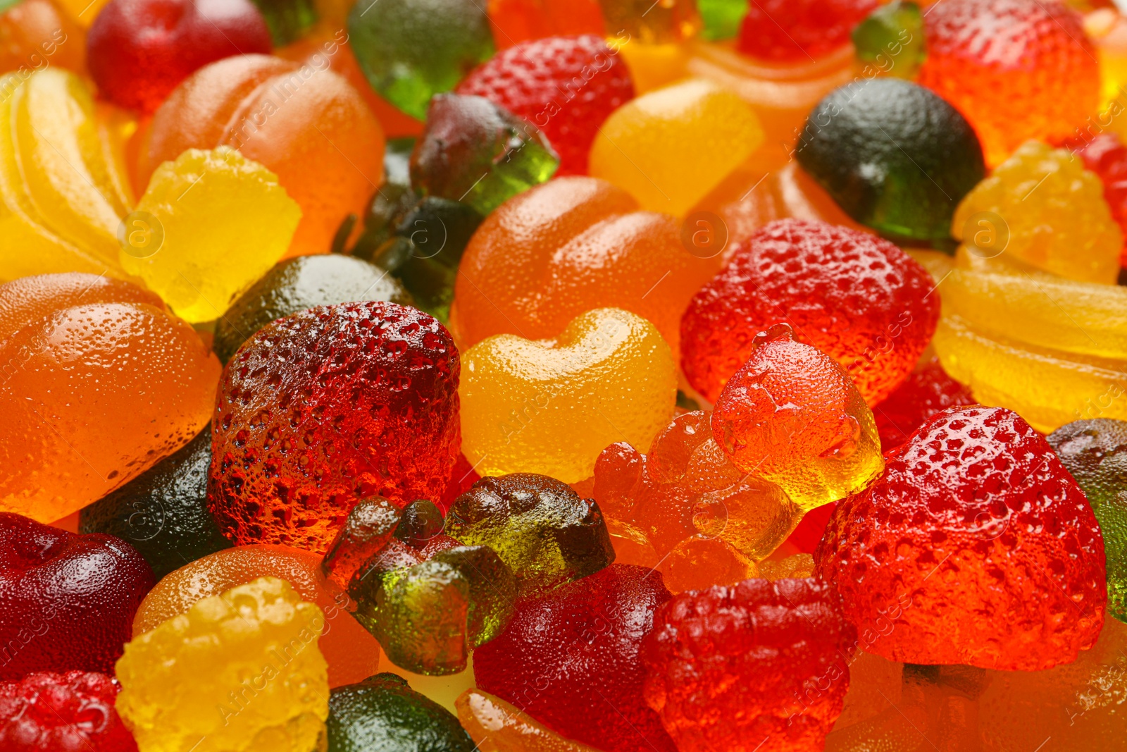 Photo of Mix of different delicious gummy candies as background, closeup