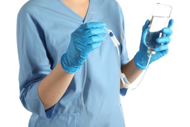 Nurse with IV infusion set on white background, closeup