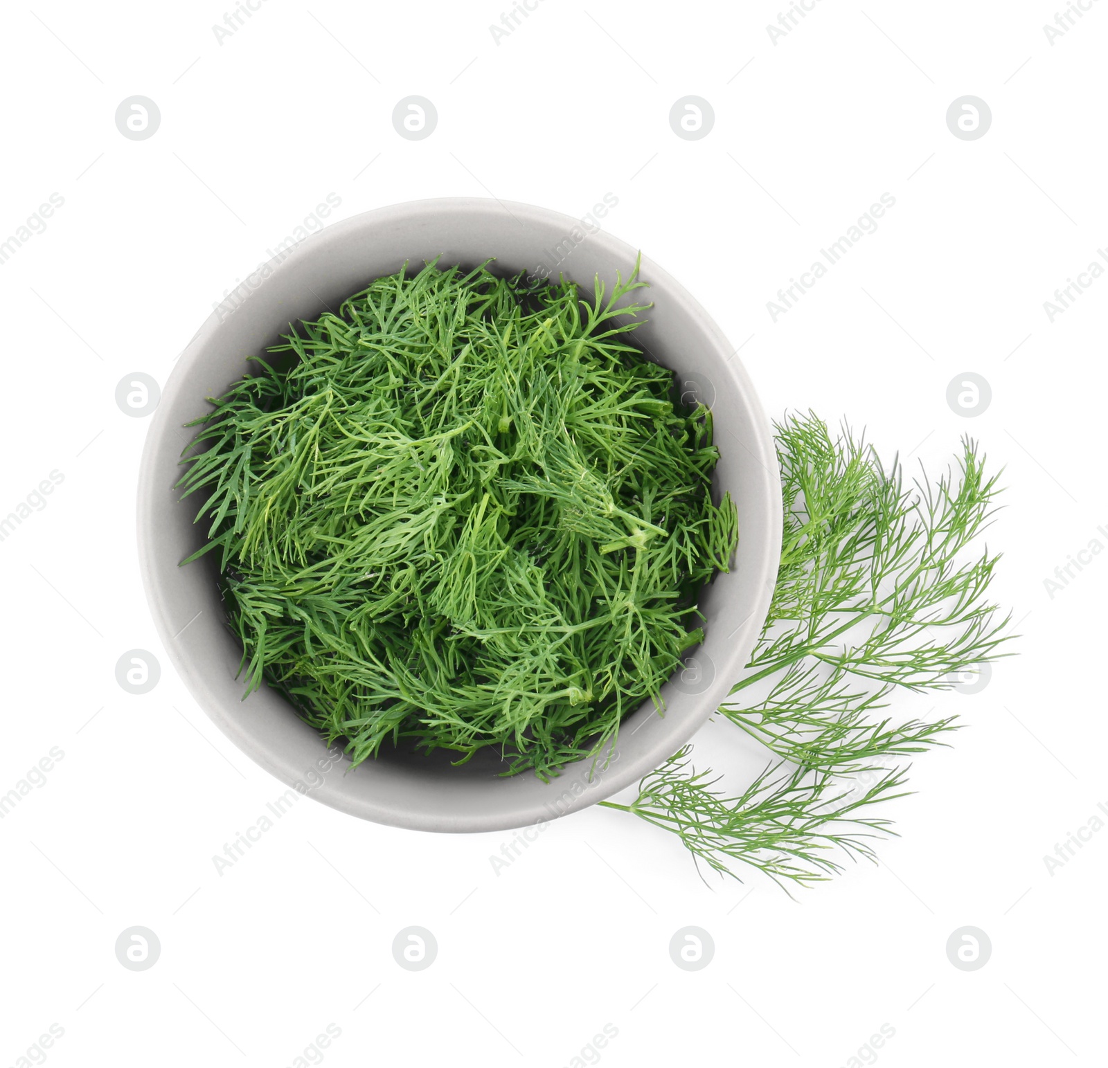 Photo of Bowl of fresh dill isolated on white, top view
