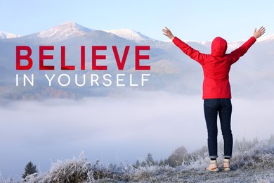 Image of Motivational quote Believe In Yourself. Text near tourist in mountains