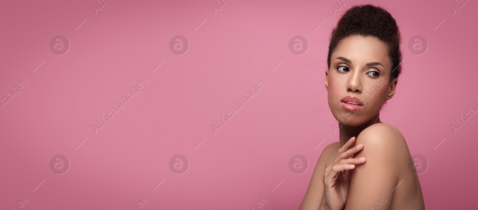 Image of Portrait of beautiful young woman on pink background. Banner design with space for text