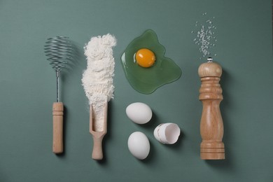 Photo of Flat lay composition with whisk and dough ingredients on pale blue background