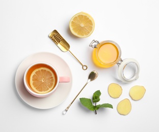 Composition with lemon tea, honey and ginger on white background, top view