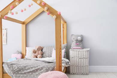 Stylish child room interior with comfortable bed