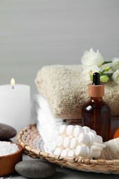 Photo of Beautiful composition with burning candles and different spa products on table, closeup