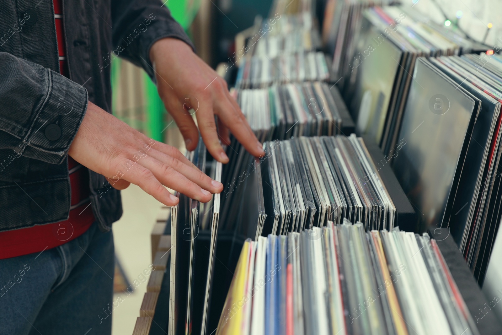 Image of Man choosing vinyl records in store, closeup