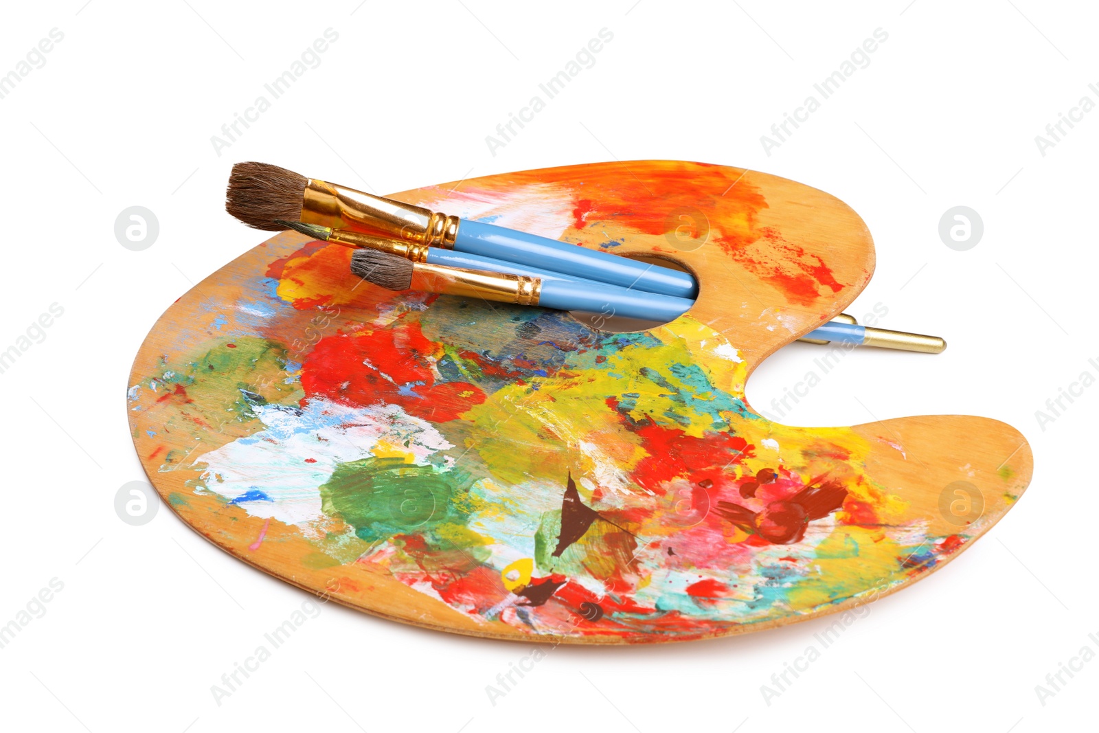 Photo of Palette with paints and brushes on white background. Artist equipment