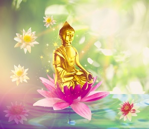 Image of Buddha figure with lotus flowers on water