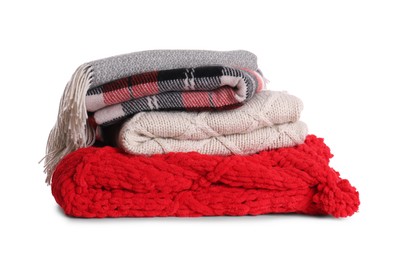 Photo of Stack of folded warm plaids on white background