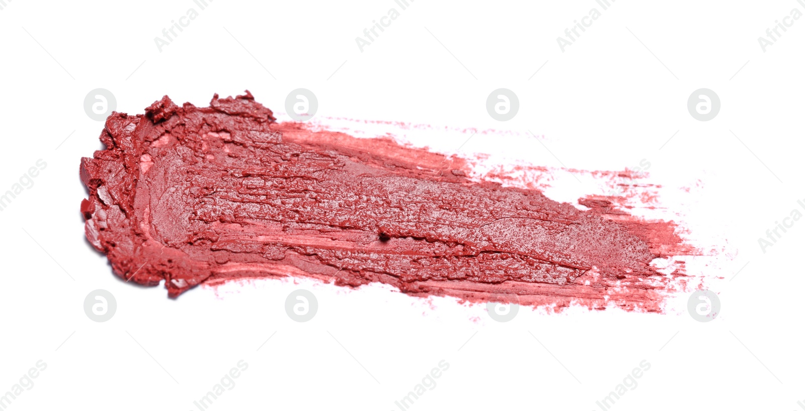 Photo of Smear of bright lipstick on white background