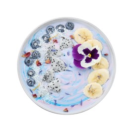 Photo of Delicious smoothie bowl with fresh fruits, blueberries and flower isolated on white, top view