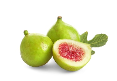 Photo of Whole and cut green figs on white background