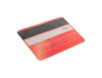 Red plastic credit card isolated on white