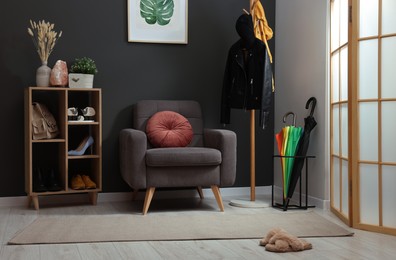 Modern hallway interior with stylish furniture and decorative elements