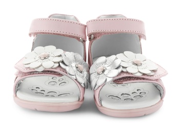 Pair of pink baby sandals decorated with flowers on white background