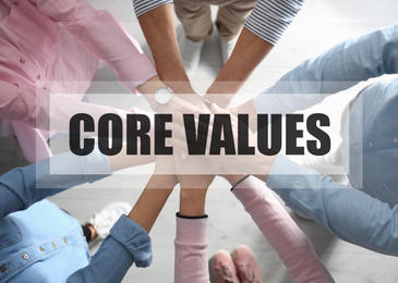 Core values concept. People holding hands together, top view