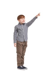 Little boy pointing at something on white background