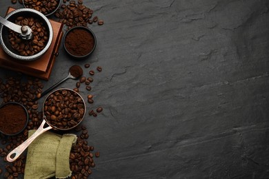 Flat lay composition with coffee grounds and roasted beans on black background, space for text