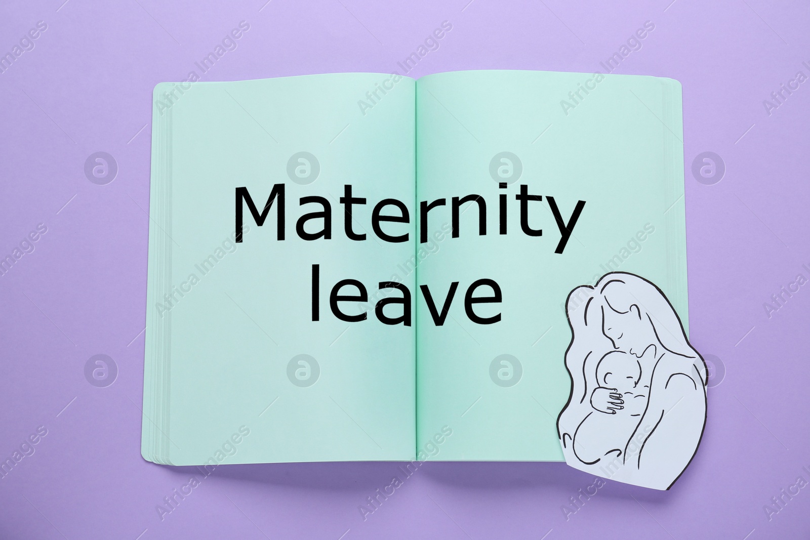 Photo of Maternity leave concept. Notebook with paper cutout of mother and child on violet background, top view