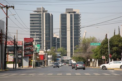 Photo of San Pedro Garza Garcia, Mexico – March 20, 2023: Beautiful view of city street with road, cars and buildings
