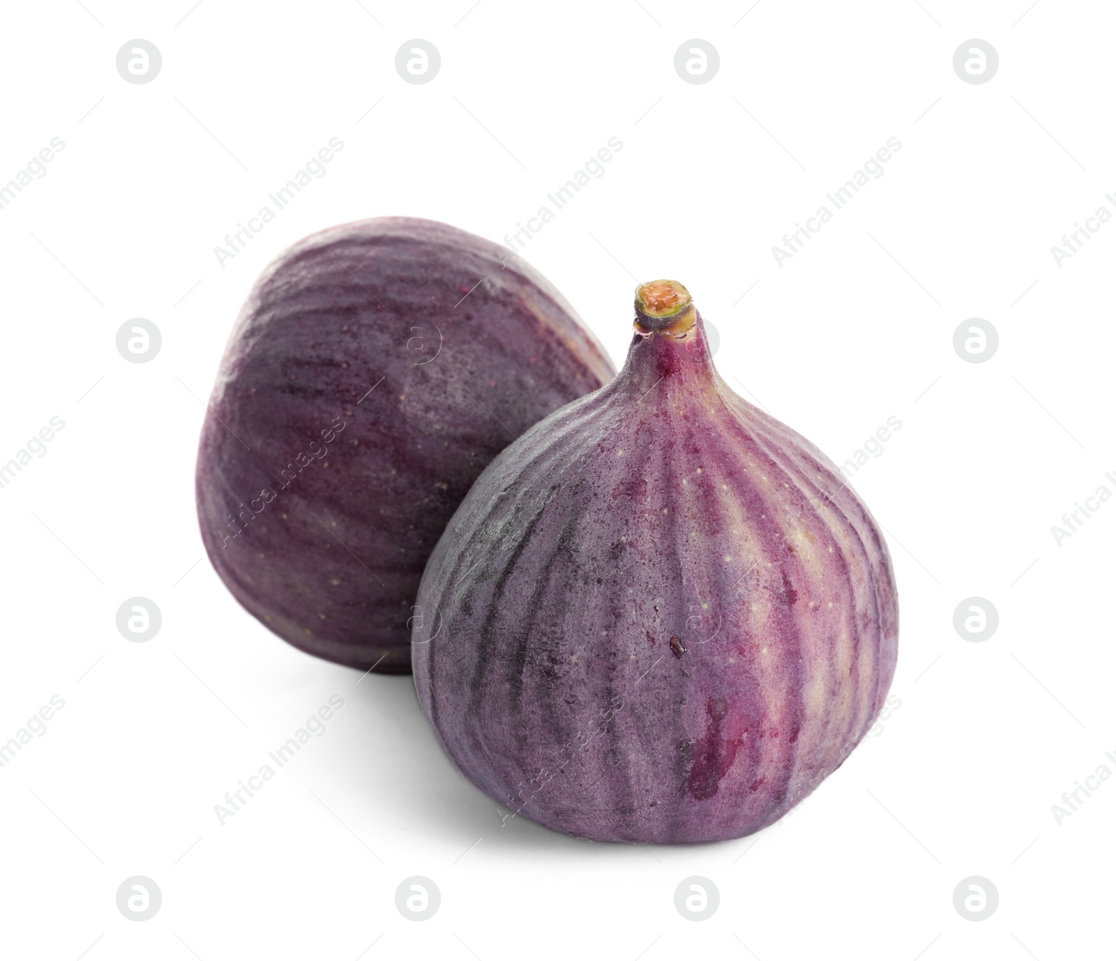 Photo of Whole ripe purple figs on white background