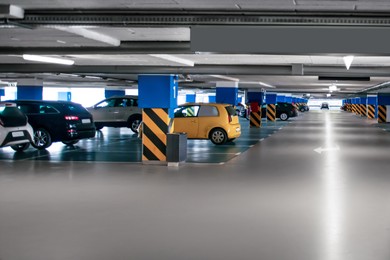 Photo of Clean parking garage with cars and lights